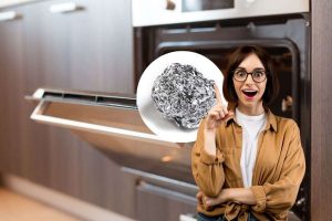 donna con idea, forno e pallina di carta argentata